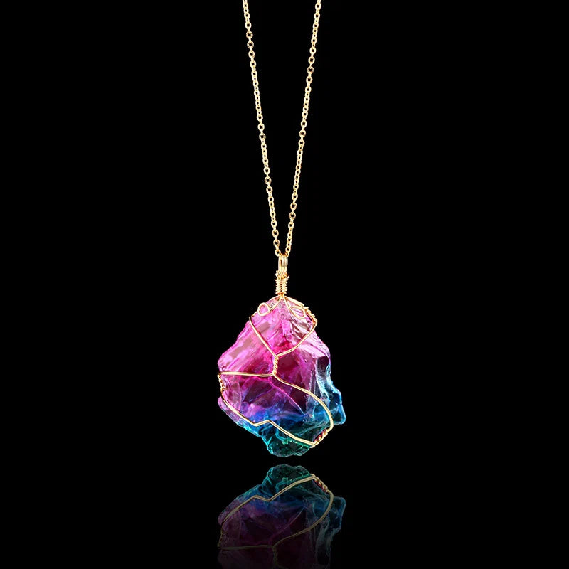 Multicolored crystal pendant on a gold chain against a black background