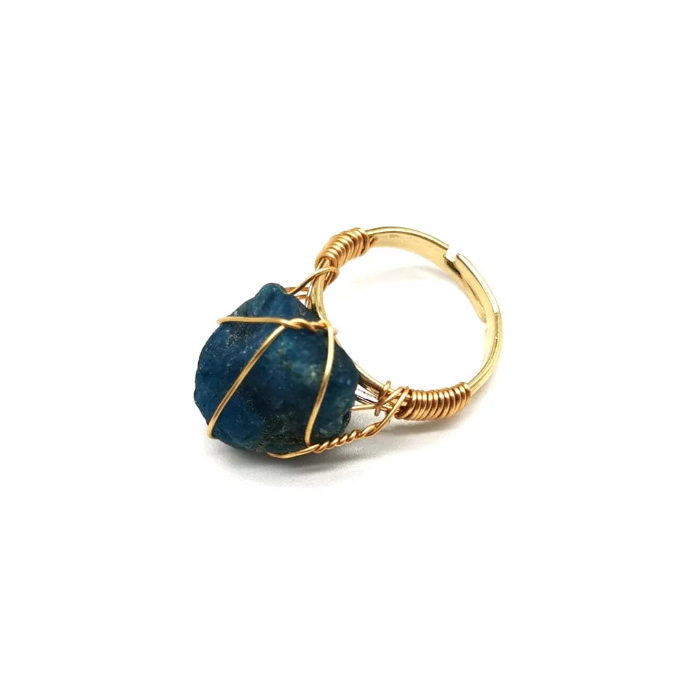 Raw aquamarine crystal ring wrapped in gold wire