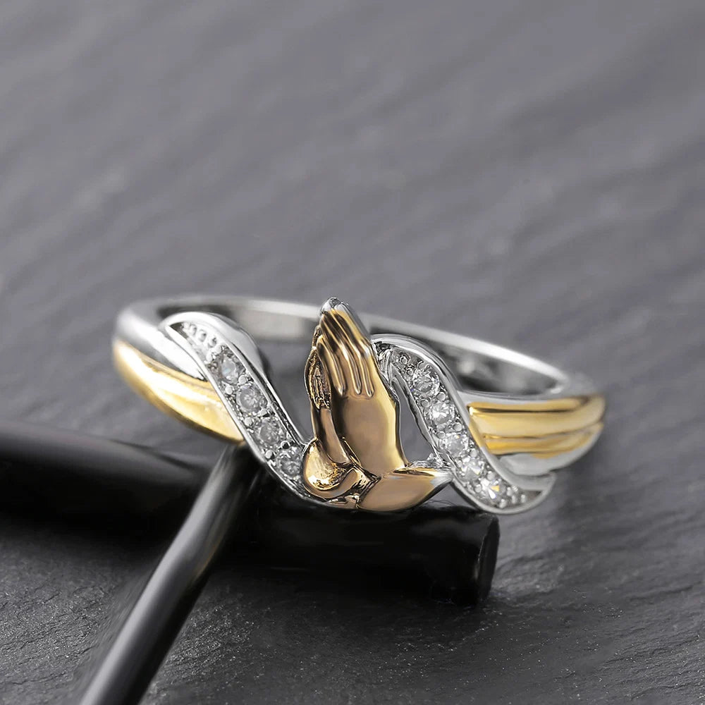 Two tone sterling silver and gold praying hands ring with CZ accents