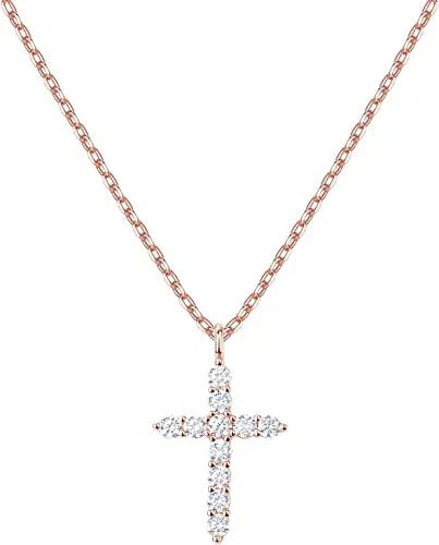 A rose gold cross pendant necklace adorned with clear cubic zirconia stones, suspended from a delicate rose gold chain against a solid white background.