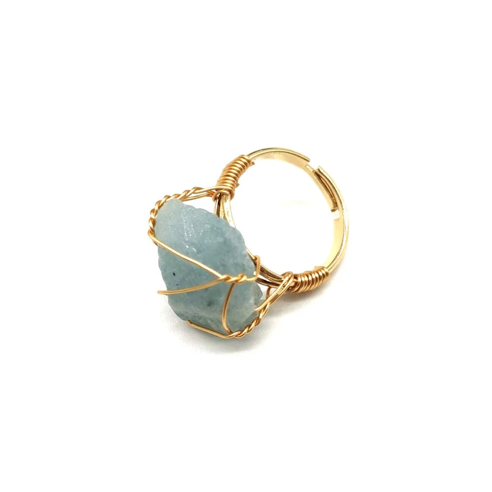 Raw blue apatite crystal ring wrapped in gold wire