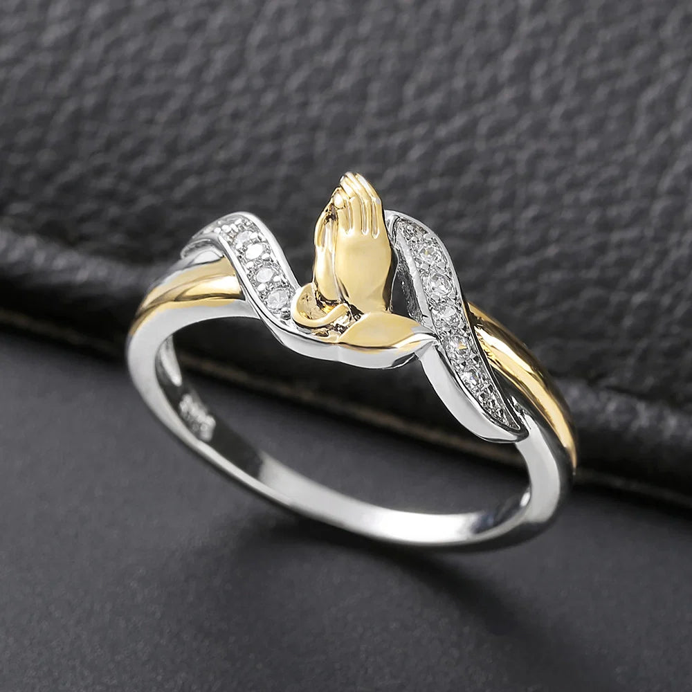 Two tone sterling silver and gold praying hands ring with CZ accents