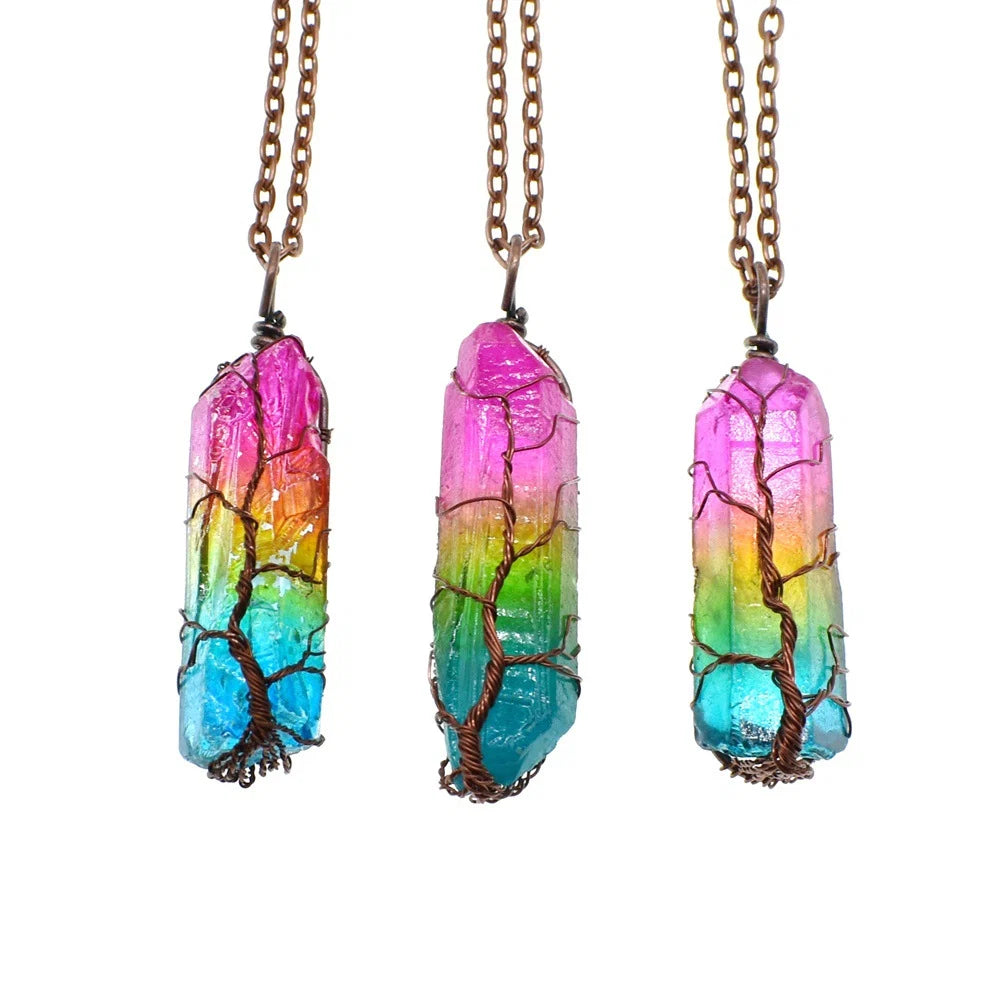 Three colorful crystal necklaces with tree designs on a white background