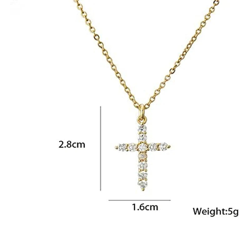 Gold cross necklace with measurements on a white background