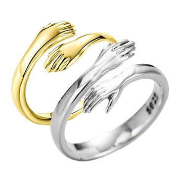 Adjustable hug ring with hugging hands design in gold and sterling silver