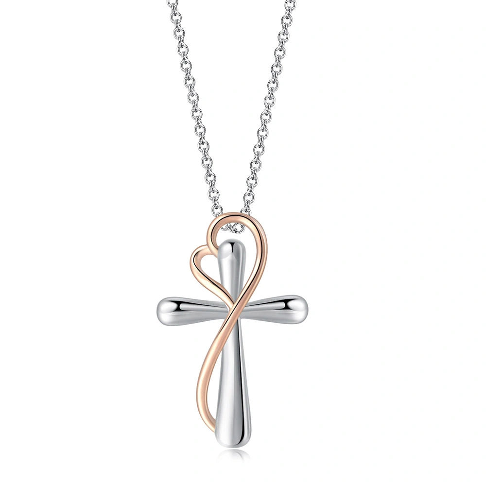 Two-tone cross necklace with heart detail on a white background