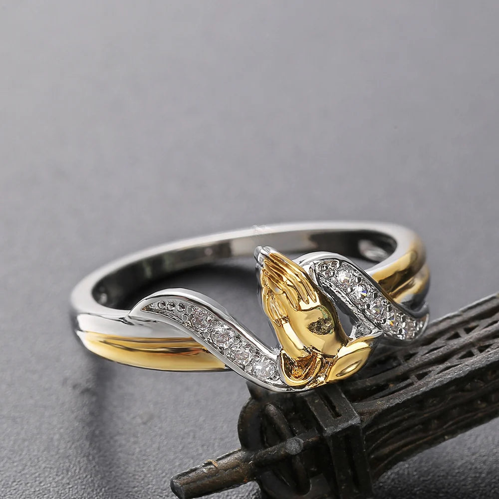 Two tone sterling silver and gold praying hands ring with CZ accents